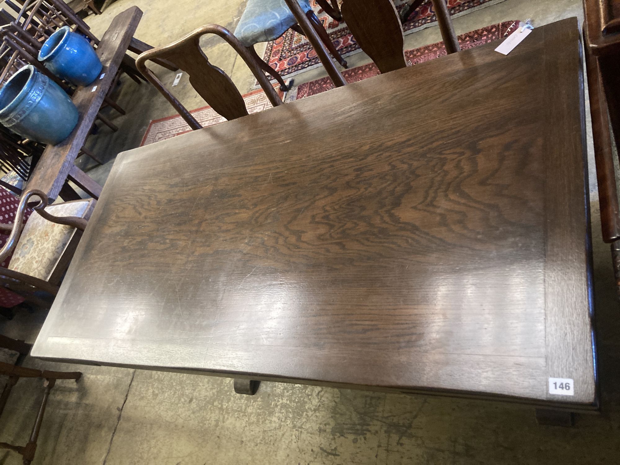 An 18th century style oak draw leaf dining table, width 150cm, depth 75cm, height 77cm